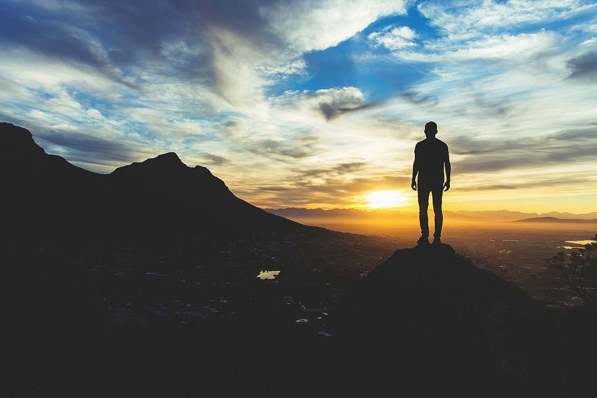 cape town person standing at the top of mountain south africa
